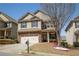 Charming two-story home featuring a brick and siding facade, two-car garage and landscaped front yard at 2409 Brynfield Cv, Suwanee, GA 30024