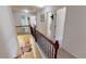 Upstairs hallway with views to lower level and doorways leading to bedrooms at 2409 Brynfield Cv, Suwanee, GA 30024