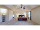 Spacious main bedroom suite with a tray ceiling, neutral carpet, and large windows providing ample natural light at 2409 Brynfield Cv, Suwanee, GA 30024