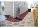 A beautiful side yard with gravel, stepping stones, and mulched garden bed with plants at 2409 Brynfield Cv, Suwanee, GA 30024