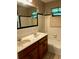 Bathroom with a bathtub, tiled shower, and a double sink at 406 Dallas Hwy, Villa Rica, GA 30180