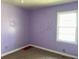 Bedroom featuring a lilac wall paint, one window and carpeting at 406 Dallas Hwy, Villa Rica, GA 30180