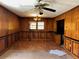 Dining Room with wood paneling, hardwood floors, a ceiling fan, and natural light at 406 Dallas Hwy, Villa Rica, GA 30180