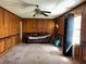 Spacious living room with wood paneling, ceiling fan, and natural light at 406 Dallas Hwy, Villa Rica, GA 30180