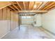 Unfinished basement with fireplace and exposed beams, ready for personalized updates at 1477 Patricia Dr, Morrow, GA 30260