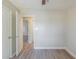 Large bedroom with fresh neutral paint, featuring two closets, and new hardwood floors at 1477 Patricia Dr, Morrow, GA 30260