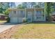 Charming split-level home with a welcoming front porch and a two-car garage at 1477 Patricia Dr, Morrow, GA 30260