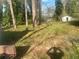 Sloping backyard with mature trees at 1905 Robinhill Ct, Tucker, GA 30084