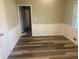 Comfortable bedroom featuring stylish wood-look flooring and fresh paint at 1905 Robinhill Ct, Tucker, GA 30084