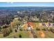 Scenic aerial view of a home nestled within a lush, green landscape and surrounded by trees at 4285 Haynes Cir, Snellville, GA 30039