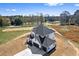 Aerial view of a two-story home, dark gray roof and a two car garage at 4285 Haynes Cir, Snellville, GA 30039