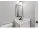 Modern bathroom featuring a stylish vanity with a rectangular mirror and sleek fixtures at 4285 Haynes Cir, Snellville, GA 30039