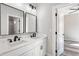 Bathroom featuring double sinks, framed mirrors, and modern black fixtures at 4285 Haynes Cir, Snellville, GA 30039