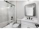 Modern bathroom featuring a glass-enclosed shower and a sleek vanity with a rectangular mirror at 4285 Haynes Cir, Snellville, GA 30039