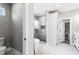 Bathroom featuring a glass-enclosed shower, soaking tub, and walk-in closet at 4285 Haynes Cir, Snellville, GA 30039
