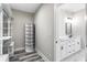 Spacious walk-in closet adjacent to a stylish bathroom with modern fixtures at 4285 Haynes Cir, Snellville, GA 30039