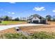 Charming two-story home with a long driveway, two car garage and large front yard at 4285 Haynes Cir, Snellville, GA 30039