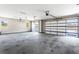 Spacious two car garage with windows in doors and room for storage with smooth concrete floor at 4285 Haynes Cir, Snellville, GA 30039