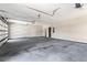 Large two-car garage features a smooth concrete floor with windows on the garage door for lots of light at 4285 Haynes Cir, Snellville, GA 30039