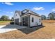 Attached two car garage with a modern design, stone accents and a long driveway at 4285 Haynes Cir, Snellville, GA 30039