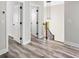 Hallway featuring luxury vinyl plank flooring, white trim, and a staircase at 4285 Haynes Cir, Snellville, GA 30039