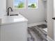 Convenient laundry room with sink and quartz countertops at 4285 Haynes Cir, Snellville, GA 30039