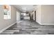 Large neutral living room with dark floors, view to the kitchen and covered porch at 4285 Haynes Cir, Snellville, GA 30039