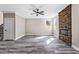 Spacious living room with stone fireplace, wood-look floors and bright windows at 4285 Haynes Cir, Snellville, GA 30039