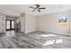 Neutral living room with dark floors, staircase, and paneled doors at 4285 Haynes Cir, Snellville, GA 30039