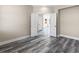 Neutral room with wood-look floors, paneled doors, and bright windows at 4285 Haynes Cir, Snellville, GA 30039