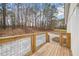 Back deck looking out at gravel driveway and wooded area at 75 Woodfield Rd, Covington, GA 30014