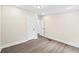 Freshly painted bedroom with sleek floors and a closet for optimal storage at 75 Woodfield Rd, Covington, GA 30014