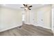 Bright bedroom with ceiling fan, sleek flooring and a closet with doors at 75 Woodfield Rd, Covington, GA 30014