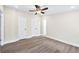 This bright bedroom features modern flooring and two closets for ample storage at 75 Woodfield Rd, Covington, GA 30014