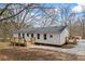 Freshly painted single-story home with new wooden deck and neutral surroundings at 75 Woodfield Rd, Covington, GA 30014