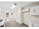 Bright kitchen featuring white cabinets, updated countertops, and new floors at 75 Woodfield Rd, Covington, GA 30014