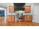 Gourmet kitchen featuring stainless steel appliances and a stylish range hood above the stove at 101 Gold Leaf Ct, Canton, GA 30114