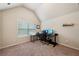 Office bedroom features a window, dark-colored desk, and carpet, ideal for a study or workspace at 104 Amelia Way, Ellenwood, GA 30294