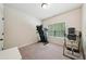 Bright bedroom with carpeted floors, a window with blinds and space for a treadmill at 104 Amelia Way, Ellenwood, GA 30294