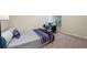 Bedroom featuring a bed and an office area with a desk and computer setup near the window at 104 Amelia Way, Ellenwood, GA 30294