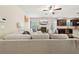Bright living area featuring modern sofa, fireplace, and open layout, perfect for entertaining at 104 Amelia Way, Ellenwood, GA 30294