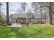 Spacious backyard featuring a patio area with a pergola, ideal for enjoying the outdoors at 1495 Longwood Sw Dr, Marietta, GA 30008