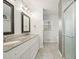 Clean, modern bathroom with double vanity, granite countertop, and glass-enclosed shower at 1495 Longwood Sw Dr, Marietta, GA 30008