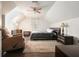 Bright bedroom featuring a ceiling fan, dark wood floors, and a recliner at 1495 Longwood Sw Dr, Marietta, GA 30008