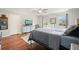Relaxing bedroom with hardwood floors, two windows, and tv at 1495 Longwood Sw Dr, Marietta, GA 30008