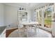 Cozy breakfast nook with white table, chairs, and lots of light at 1495 Longwood Sw Dr, Marietta, GA 30008