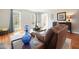 Comfortable living room with hardwood floors, large windows, and view to the front entry at 1495 Longwood Sw Dr, Marietta, GA 30008