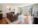 Bright living room with hardwood floors, fireplace, and large windows for natural light at 1495 Longwood Sw Dr, Marietta, GA 30008