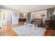 Open floor plan living room with hardwood floors and view to kitchen at 1495 Longwood Sw Dr, Marietta, GA 30008