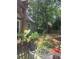 Outdoor patio with lush landscaping and potted plants creating a serene and inviting space at 1495 Longwood Sw Dr, Marietta, GA 30008